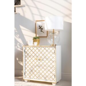 wooden accent cabinet. Elegant tones of white and gold add stylish allure to this piece. The front is adorned with a gold lattice design for a lavish