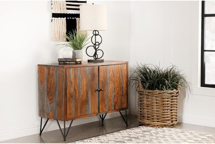 Bring a modern expression to your bohemian style space with this rustic industrial accent cabinet. A large and boxy