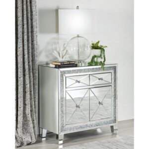 Shimmering accents and polished elements come together in this glam accent cabinet. Covered entirely in clear mirror surfaces and beveled mirror trim and tile