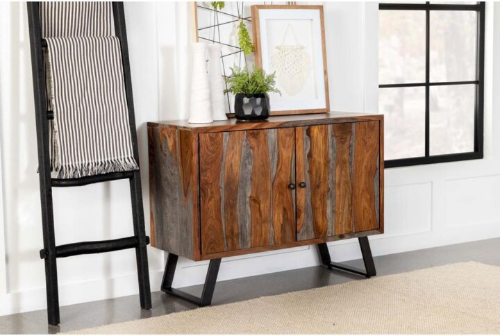 Transform a space with this rustic industrial accent cabinet. Featuring a large spacious cabinet with an interior shelf