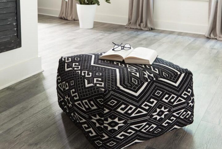 Reminisce of adventures abroad with this black and white accent stool. You'll love to celebrate diverse culture with the exotic theme of the tribal motif. The neutral palette of this eccentric stool makes it a great accent in any eclectic space. The square pouf design adds a cushy option for floor seating as well. Perfect in a bedroom or living room