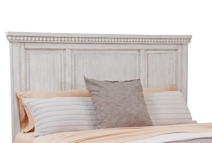 The Salter Path Panel Headboard is a casual classic with modern touches and designer details.  The White Oyster wire-brushed finish with flecks of gray offers a natural textured look.  Dentil molding and raised panels are crafted from solid mahogany and veneers and are highlights of this beautiful headboard.  Available in King or Queen sizes.  Attaches to most standard metal bed frames.