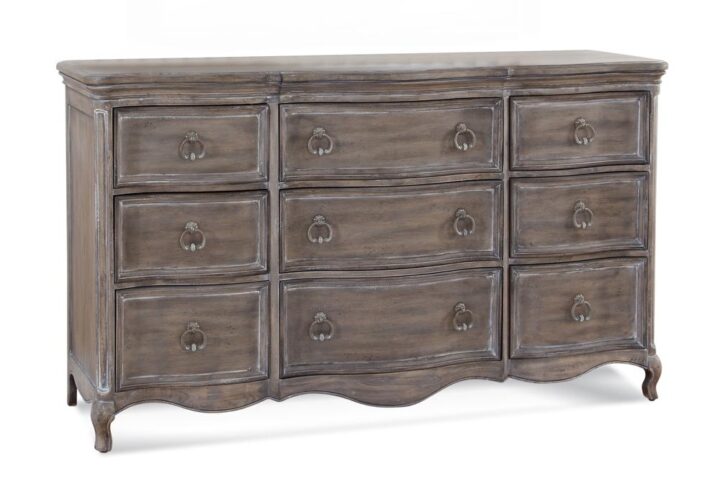 The Genoa Bedroom collection lends a romantic yet relaxed atmosphere to your space.   The trendy distressed antique grey finish accents the graceful serpentine fronts of the pieces.  The Genoa Triple Dresser features 9 spacious drawers for storage including felt lining in the top drawers to protect your finer things.  Your purchase includes one dresser only.