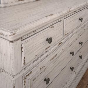 The Providence Bedroom Collection presents a rustic vibe combined with a stately and eloquent feel.  The distressed antique white finish features rub through giving the pieces that well worn look.  The dresser boasts seven spacious drawers for storage with felt lining in the top three drawers to protect your finer things.  Drawers feature English Dovetail construction with smooth operating  roller bearing side glides.  Antique brass knobs add to the vintage feel.  Your purchase includes one dresser.