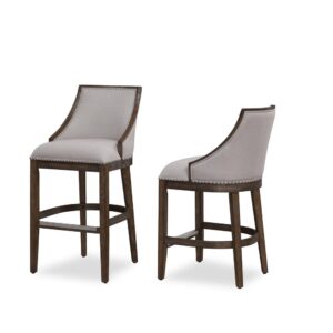 Defined by gracefully swooped arms and brushed nickel nailhead trim the Gilford bar stool will be an elegant addition to your kitchen or bar. The solid hardwood frame is finished in driftwood brown and accented by beautiful beige fabric on the seat and back. Sturdy tapered legs and a four-sided stretcher provide strength and a comfortable footrest protected by a metal kickplate.