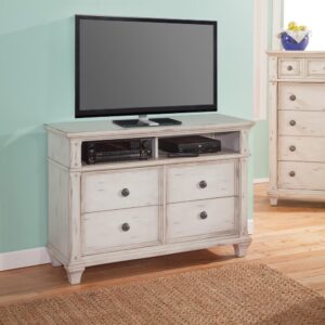 tapered and flared bun feet forming a lovely silhouette. The Sedona Media Chest features four spacious bottom drawers and two media component openings with cord management openings to keep things neat and organized.