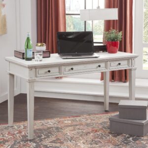 The Sedona Writing Desk is trending for a look that is rustic yet refined.  The distressed antique cobblestone white finish with rub through and detailed molding creates a sense of vintage charm in an up to date style.  Sturdily crafted of kiln-dried hard wood solids with mango veneers and drawers with English dovetail joinery and full extension ball bearing metal side guides for ease of operation.  The three drawers feature picture framed drawer fronts with antiqued metal knobs and provide ample storage space to keep you well organized.