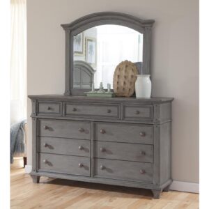 tapered and flared bun feet forming a lovely silhouette. The Sedona dresser features 9 spacious drawers with dust panels on the bottom cases for added protection.  The beveled mirror features an arched frame to perfectly complement the matching dresser.  Your purchase includes one dresser and one mirror.