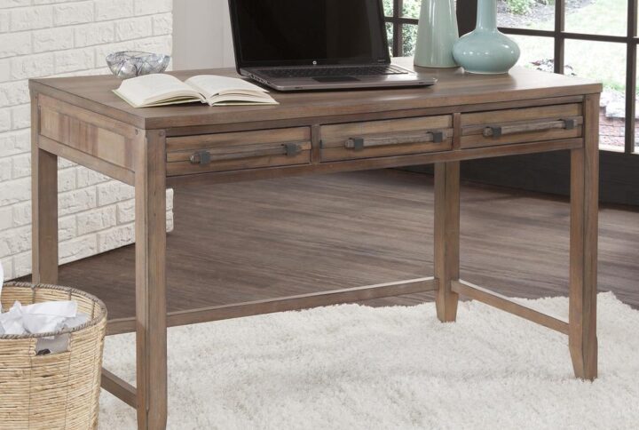 The Aurora Writing Desk has rustic character paired with industrial features in an antiqued weathered grey finish for today's casual lifestyle.  Sturdily constructed of kiln-dried hardwoods and veneers with three drawers featuring ball bearing side guides for smooth operation.