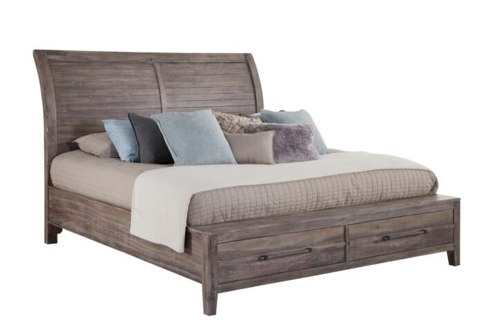The Aurora bedroom collection has rustic character paired with industrial features in an antiqued weathered grey finish that lends a feeling of strength and simplicity.  The simple sleigh-inspired frame is accented by planked details and heavy molding.  The footboard offers two storage drawers for your blankets and pillows. Your purchase includes the king headboard