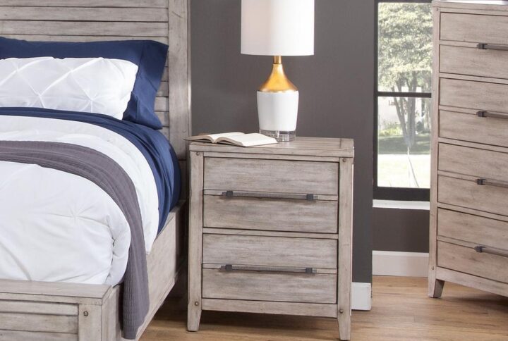 The Aurora has rustic character paired with industrial features in an antiqued whitewashed finish that lends a feeling of strength and simplicity.  The Aurora Two Drawer Nightstand provides stylish bedside storage.  Construction features include roller bearing side guides