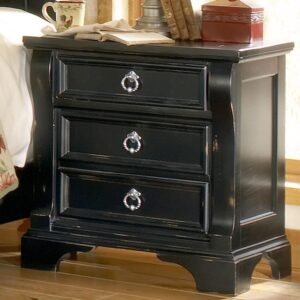 An heirloom is a timeless treasure that passes from generation to generation bringing each family member immeasurable joy through memories. The Heirloom Night Stand is a masterful piece of tradition that is finished in a distressed black finish with hints of gold rubbed through. From the heavy top to the beaded drawer fronts this chest of drawers was made to love for generations. The pewter ring pulls are brushed for a traditional look and feel. The drawers are center guided with positive drawer stops for years of smooth quiet function. And the 14 ½" drawers have English dovetail construction and fully finished interiors for a lifetime of snag free use. The top drawer has a felt lined bottom to keep your smaller night time essentials from shifting around or to protect your daily jewelry. Enjoy a tradition of creating ageless family heirlooms with the Heirloom Three Drawer Night Stand.