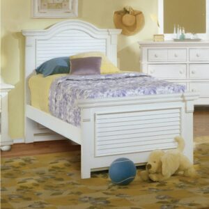 the vintage breakfront look formed by the coped crown blocks on both the headboard’s gracefully arched crown overlay and the footboard’s straight cap rail lends to the handcrafted look. Wide molding houses the decorative louvered inserts on both the headboard and footboard and ties the pieces of this collection together.  Wide vertical posts add weight to both headboard and footboard. Mortise and tenon construction