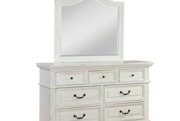 Make the warm and welcoming Stonebrook Bedroom collection a part of your home.  The Distressed Antique White finish gives character to this well crafted collection.  The Stonebrook Dresser and Mirror features 7 drawers for abundant storage along with detailed molding and hammered metal knobs and drawer pulls.  To prevent snagging
