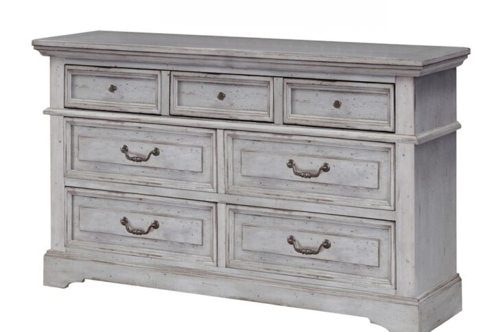 Make the warm and welcoming Stonebrook Bedroom collection a part of your home.  The Antique Gray finish is lightly distressed giving character to this well crafted collection.  The Stonebrook Dresser features 7 drawers for abundant storage along with detailed molding and hammered metal knobs and drawer pulls.  To prevent snagging