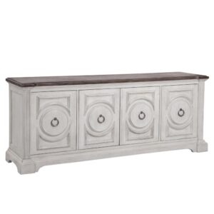 Experience southern charm with a modern twist when you choose the Brighten 84" Console.  The heavily distressed antique white finish is complemented by the antique charcoal tops and modern pewter ring door pulls.  Architectural pilasters frame the pieces and enhance the transitional circular designs and raised moldings of the door fronts.  This entertainment console features four spacious cabinets