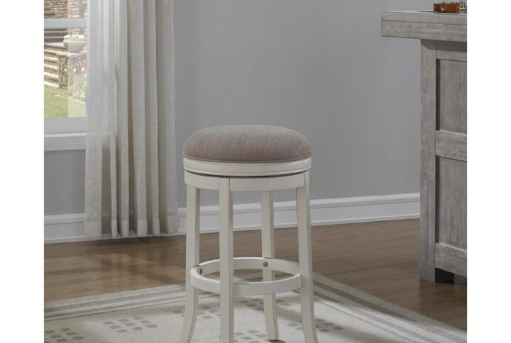 The Aversa Tall Bar Stool is a casual design that evokes the warmth of coast. Made of solid hardwood with an Antique White finish and a light brown linen seat