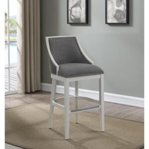 Defined by gracefully swooped arms and brushed nickel nailhead trim the Lanie counter stool will be an elegant addition to your kitchen or bar. The solid hardwood frame is finished in off-white and accented by beautiful grey fabric on the seat and back. Sturdy tapered legs and a four-sided stretcher provide strength and a comfortable footrest protected by a metal kickplate.