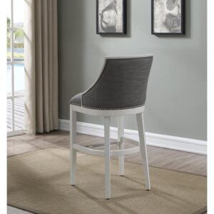 Defined by gracefully swooped arms and brushed nickel nailhead trim the Lanie bar stool will be an elegant addition to your kitchen or bar. The solid hardwood frame is finished in off-white and accented by beautiful grey fabric on the seat and back. Sturdy tapered legs and a four-sided stretcher provide strength and a comfortable footrest protected by a metal kickplate.