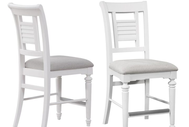 Bring instant charm and warmth to your dining space with the Cottage Traditions’ Counter Height Dining Chairs.  Finished in eggshell white