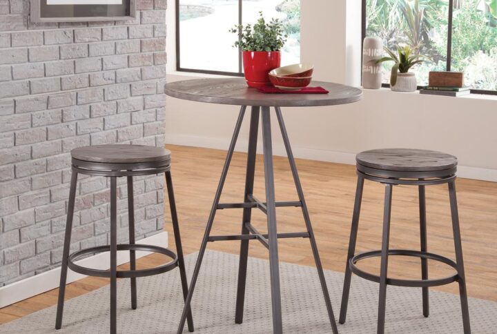 The 3 piece Chesson Bar Height Pub Table Set has a clean design and will fit with most any modern decor