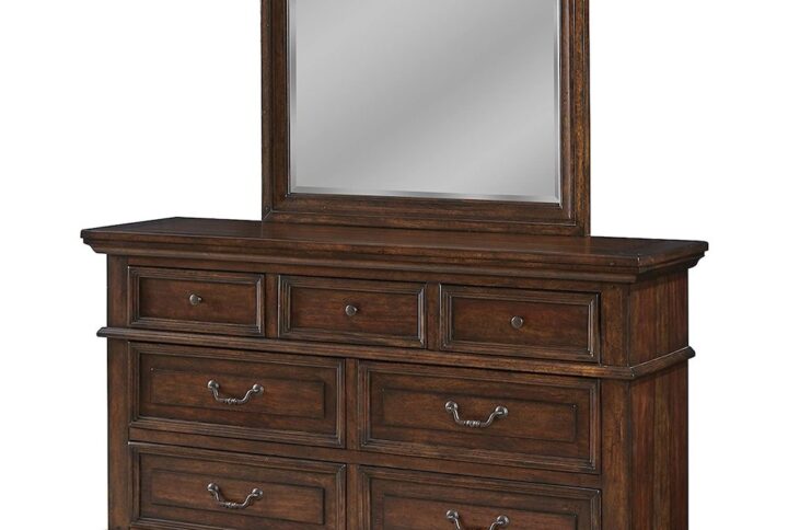 Make the warm and welcoming Stonebrook Bedroom collection a part of your home.  The rich tobacco finish is lightly distressed giving character to this well crafted collection.  The Stonebrook Dresser and Mirror features 7 drawers for abundant storage along with detailed molding and hammered metal knobs and drawer pulls.  To prevent snagging