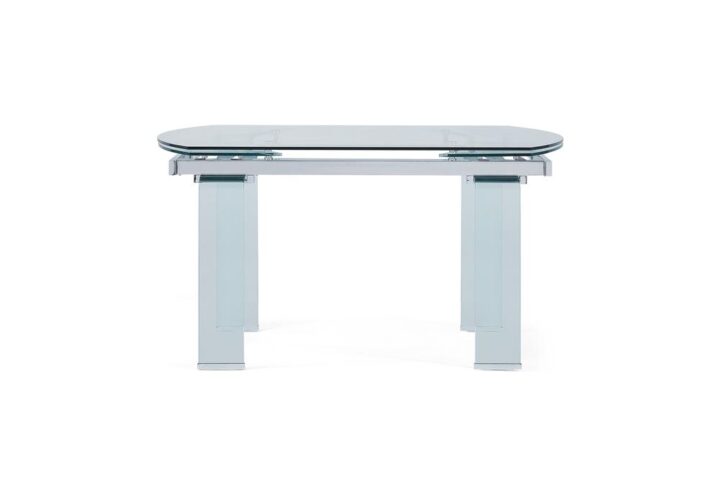 Molded tempered glass and metal combine to create a contemporary dining room table fit for the most modern or minimalist spaces. Bent glass legs