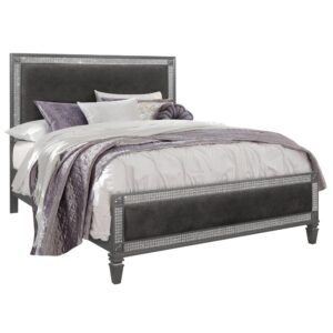 This glamours bed features unique style and design. The bed has a beautifully padded upholstered headboard with embellished crystal that outline the design along with wood corner appliques. The bed has an elegant stance. All the case pieces share the same design and are sold separately. This bed will make any room feel like a castle.