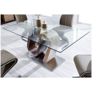Looking to make an instant style statement then this clear glass top dining table is for you! Design elements include a two toned geometrically designed base fused with a polished chrome accent and a glass top providing enough space for all your entertaining needs.