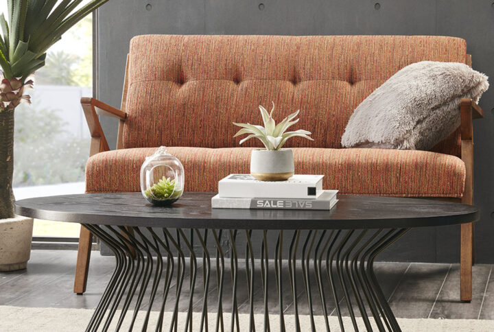 Reinvigorate your living room with the INK+IVY Mercer Oval Coffee Table. This retro coffee table flaunts an oval-shaped matte black MDF table top that creates a bold mid-century modern look. A matte black wire pedestal base provides strong support