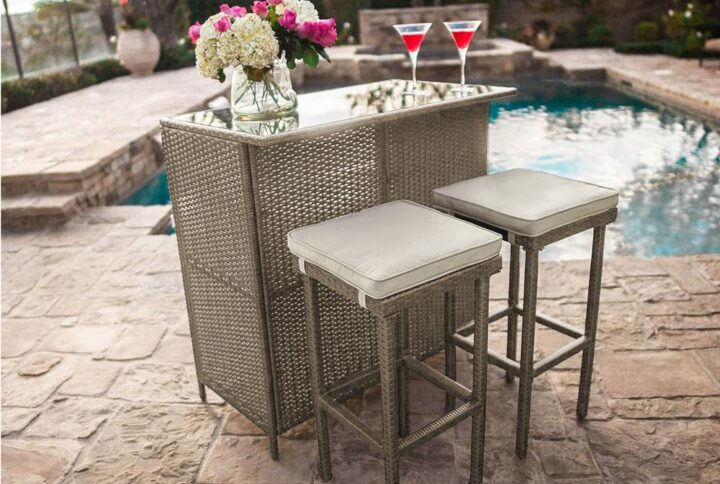 3 piece set including bar and two stoolsStools include a fabric cushionCushions are year round use & machine washable