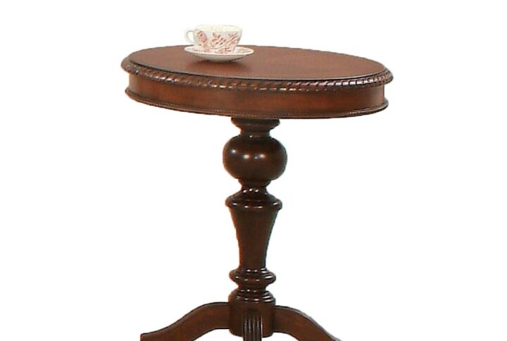 Warm medium cherry finishIntricate carving accentsPedestal style base