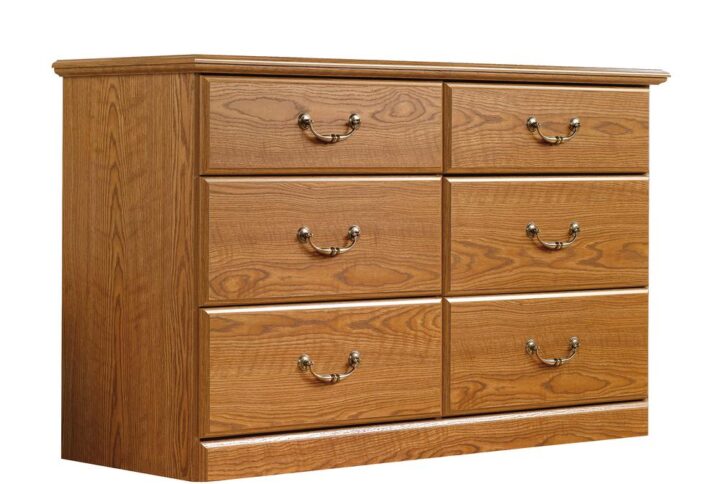 Add some stylish storage to your home with this traditional dresser from the Orchard Hills® collection. Find room for all your clothes and accessories in any of the six drawers that open and close on smooth metal runners with safety stops. Store denim