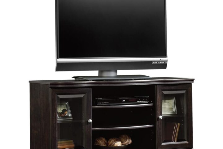 Create a warm and inviting living room or entertainment space with this charming TV stand from the Sauder Select collection. This handsome stand accommodates up to a 50" TV