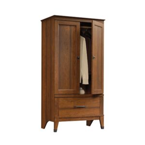 this armoire from the Carson Forge® collection keeps any room stylish and tidy. Behind its double doors is a hidden storage area that includes a garment rod for hanging clothes along with a generous amount of wardrobe space for you to store anything from dresses and button up shirts to spare blankets and your collection of shoes. This clothes storage cabinet also features a large drawer that opens and closes on smooth metal runners for additional storage of the largest sweaters