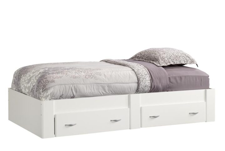 Time for a snooze? Grab and blanket and cozy up. This twin platform bed from the Beginnings® collection is sure to add clean lines and sleek design to your bedroom so you can sleep in style. It features convenient under the bed storage with two large storage drawers that create an easy access space to stow away anything from stacks of sweatshirts and your abundance of shoes to board games and an extra set of sheets and blankets. You can find room for all your stuff! It accommodates a twin-sized mattress to give you a completed look