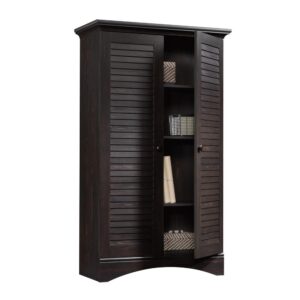 Kick clutter to the curb and get organized with this storage cabinet from the Harbor View® collection. Behind its louver detailed doors is hidden storage that contains four adjustable shelves for flexible storage options and to accommodate items of various sizes. This 2-door storage cabinet features a full upper shelf so you can store anything from clothes and shoes to blankets and food. Never worry about bedroom storage furniture that is drab—the details and finish of this wood storage cabinet set it apart from those boring storage solutions. Finished in a dark Antiqued Paint® and detailed with solid wood knobs