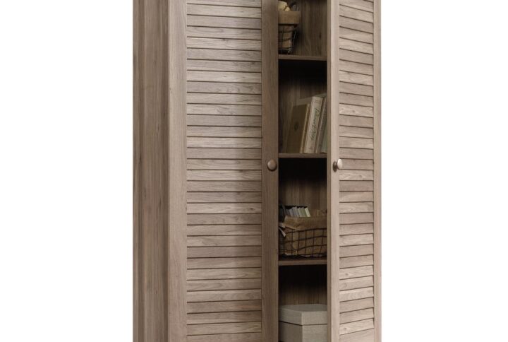 Hide the clutter and chaos with this storage cabinet from the Harbor View® collection. Behind the louver doors is a spacious hidden storage area to hide anything from decorations