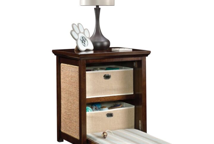 Looking for cat bed end table for your feline friend? This side table with cat bed can be used as a living room end table or bedroom nightstand. The cat bed side table features a decorative flip-down front panel that reveals a cushioned pad for cat-napping and two fabric storage baskets to stow away toys. A sisal scratch pad on each side panel gives your feline a dedicated place to stretch and scratch. Featuring birch veneer construction