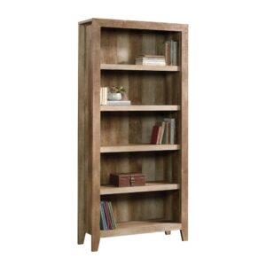 Take a pass on the ordinary. Make a bold statement with this tall 5-shelf bookcase from the Dakota Pass® collection. Finished in a traditional rustic country Craftsman Oak® and detailed with a contemporary sensibility