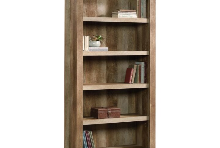 Take a pass on the ordinary. Make a bold statement with this tall 5-shelf bookcase from the Dakota Pass® collection. Finished in a traditional rustic country Craftsman Oak® and detailed with a contemporary sensibility