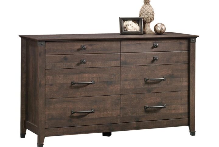 Rustic-inspired beauty and storage galore? Yes please! Give you bedroom a stylish update while adding versatile storage options for all your clothes and accessories with this dresser from the Carson Forge® collection. This handsome chest of drawers features six large drawers that open and close on smooth metal runners providing you with easy access storage for items like stacks of denim jeans and button up flannels to old sweatshirts and your secret stash of pajama pants. There is room for all your stuff! Its spacious top surface also provides ample room to store and display miscellaneous bedroom essentials and home décor items like an accent lamp