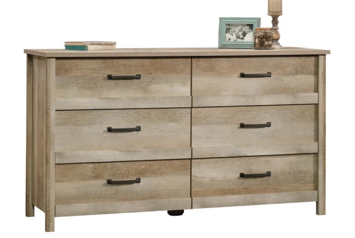 Enhance the look of your bedroom while adding versatile storage options with this 6-drawer dresser from the Cannery Bridge® collection. This handsome chest of drawers features six large drawers that open and close on smooth metal runners