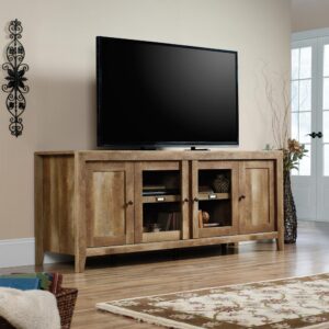 use this TV stand to hold up to a 70" TV as well as audio/video components and media storage behind closed cabinets. Or use this piece as a sideboard or beautiful display stand with open and closed shelving in the dining room or living room. Features adjustable shelving behind each door