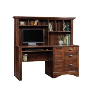 this computer desk with hutch features a slide-out keyboard shelf on metal runners to optimize your top surface storage space. This home office desk features three storage drawers