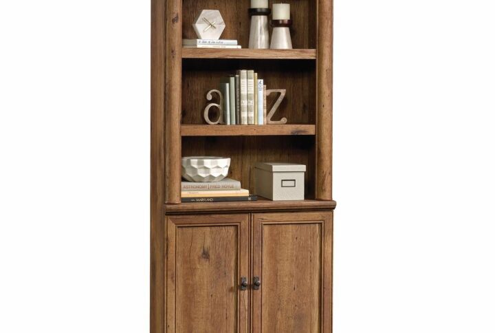 Add timeless beauty and elegant style to your home décor with this library with doors from the Palladia® collection. It features two spacious adjustable shelves that are perfect for storing and displaying anything from your collection of books