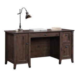 Give your office a promotion with this computer desk from the Carson Forge® collection. This home office desk has a spacious tabletop to provide you with room for all your office essentials – sticky notes