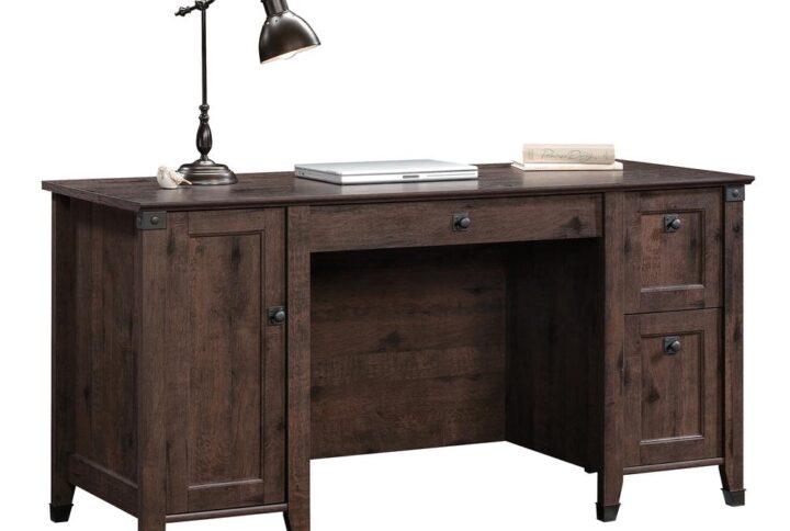 Give your office a promotion with this computer desk from the Carson Forge® collection. This home office desk has a spacious tabletop to provide you with room for all your office essentials – sticky notes