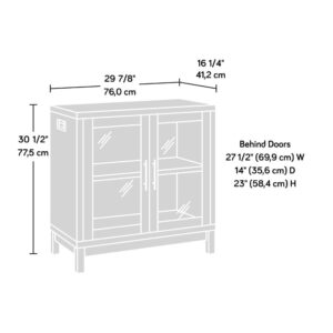 safety-tempered glass doors with a unique silkscreened pattern that is sure to stand out in your home. Behind these doors is a hidden storage space that includes a large adjustable shelf that can be moved to different heights to create flexible storage for items of all shapes and sizes. It's perfect for stowing away a variety of different items like organizing bins