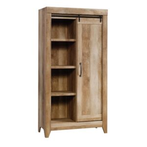 Stylish peek-a-book storage where you need it. This storage cabinet from the Adept Storage collection will solve all your storage woes and look good doing so. This farmhouse accent cabinet includes a barn-style sliding door for optimal hideaway storage options. This sliding door storage cabinet features six adjustable shelves to accommodate items of various heights and allow you to customize your accent cabinet exactly how you'd like it. With multiple shelf configuration options